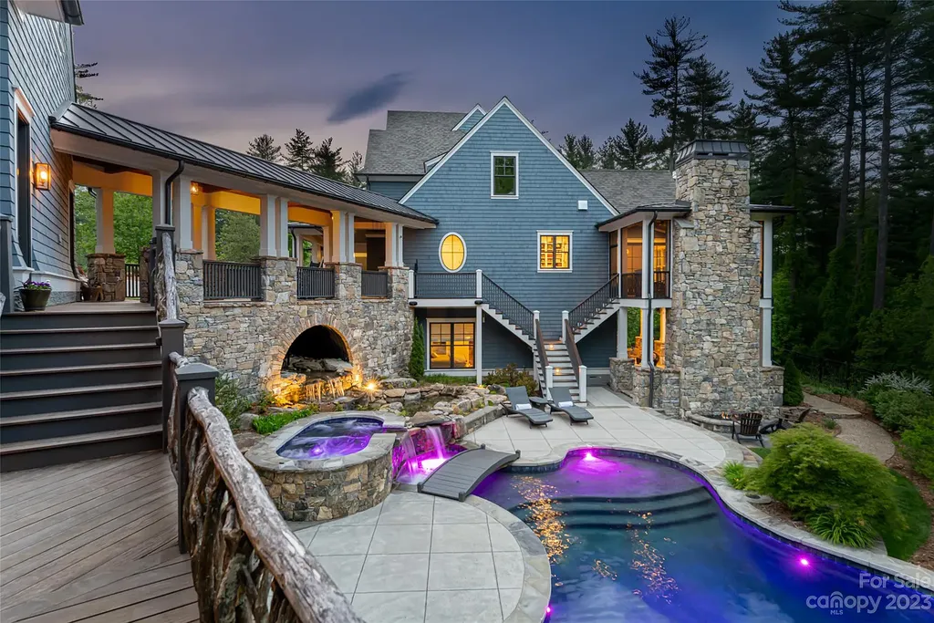 15 Presque Isle Way Home in Asheville, North Carolina. Discover the epitome of sophistication and elegance in this custom home situated on a quiet cul-de-sac. With high-quality finishes throughout, the open floor plan seamlessly integrates indoor and outdoor living spaces, including a chef's kitchen, great room, dining area, and a main level primary suite. 