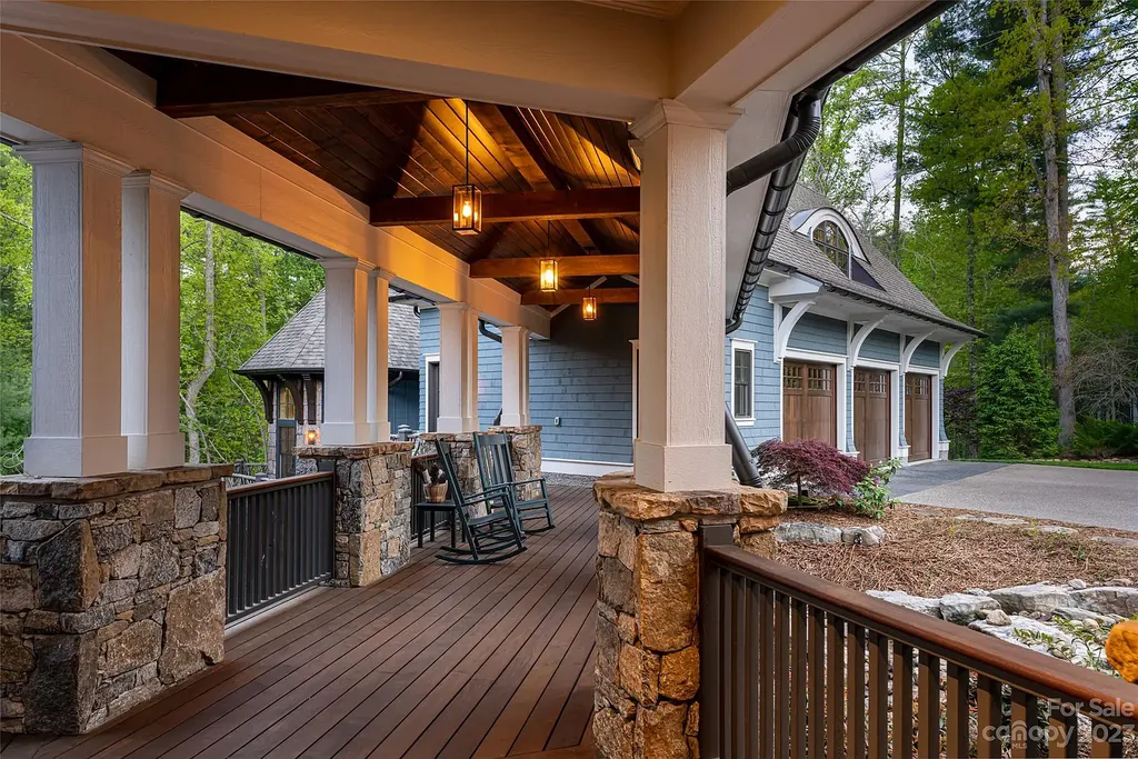 15 Presque Isle Way Home in Asheville, North Carolina. Discover the epitome of sophistication and elegance in this custom home situated on a quiet cul-de-sac. With high-quality finishes throughout, the open floor plan seamlessly integrates indoor and outdoor living spaces, including a chef's kitchen, great room, dining area, and a main level primary suite. 