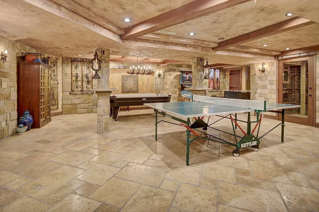 16 Evergreen Road Home in North Oaks, Minnesota. Experience luxury living at its finest in this exceptional estate nestled within the esteemed North Oaks Community, situated on the original James J. Hill Homestead. This remarkable property offers a plethora of outstanding features, including an awe-inspiring pool area adorned with fountains, lights, hidden waterproof speakers, a jacuzzi, and even an indoor sauna.