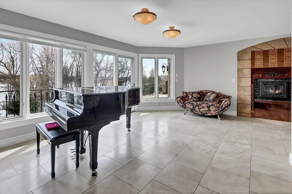 16 Evergreen Road Home in North Oaks, Minnesota. Experience luxury living at its finest in this exceptional estate nestled within the esteemed North Oaks Community, situated on the original James J. Hill Homestead. This remarkable property offers a plethora of outstanding features, including an awe-inspiring pool area adorned with fountains, lights, hidden waterproof speakers, a jacuzzi, and even an indoor sauna.