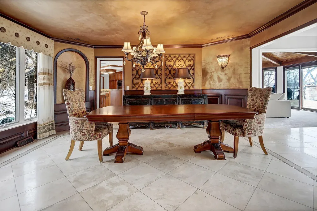16 Evergreen Road Home in North Oaks, Minnesota. Experience luxury living at its finest in this exceptional estate nestled within the esteemed North Oaks Community, situated on the original James J. Hill Homestead. This remarkable property offers a plethora of outstanding features, including an awe-inspiring pool area adorned with fountains, lights, hidden waterproof speakers, a jacuzzi, and even an indoor sauna.