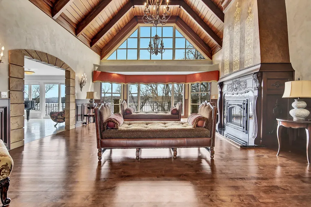 16 Evergreen Road Home in North Oaks, Minnesota. Experience luxury living at its finest in this exceptional estate nestled within the esteemed North Oaks Community, situated on the original James J. Hill Homestead. This remarkable property offers a plethora of outstanding features, including an awe-inspiring pool area adorned with fountains, lights, hidden waterproof speakers, a jacuzzi, and even an indoor sauna.