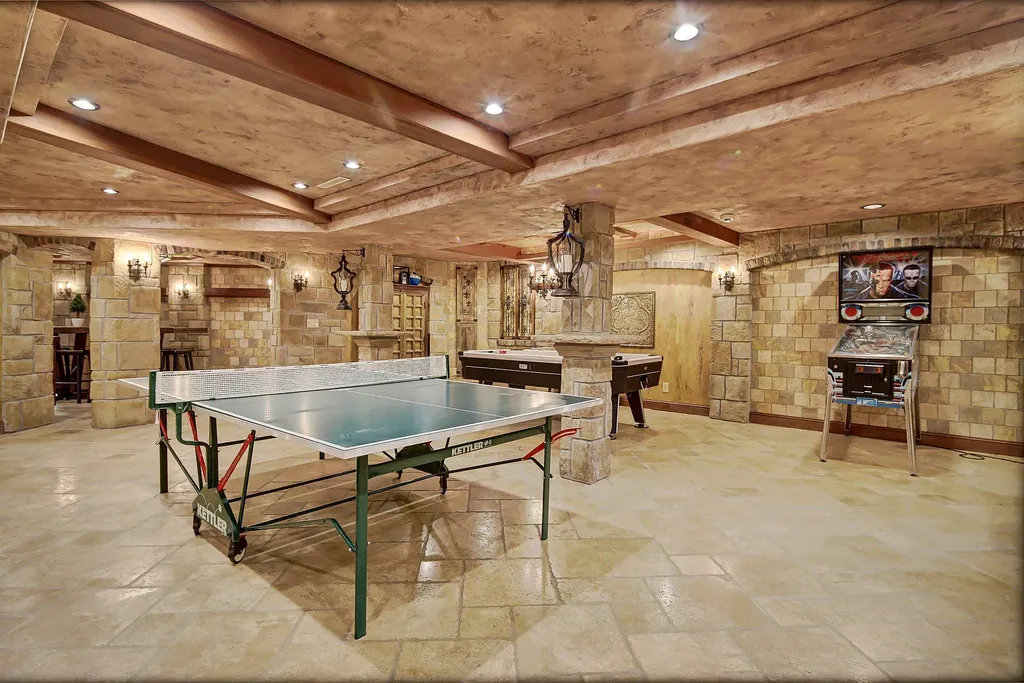 16 Evergreen Road Home in North Oaks, Minnesota. Experience luxury living at its finest in this exceptional estate nestled within the esteemed North Oaks Community, situated on the original James J. Hill Homestead. This remarkable property offers a plethora of outstanding features, including an awe-inspiring pool area adorned with fountains, lights, hidden waterproof speakers, a jacuzzi, and even an indoor sauna.