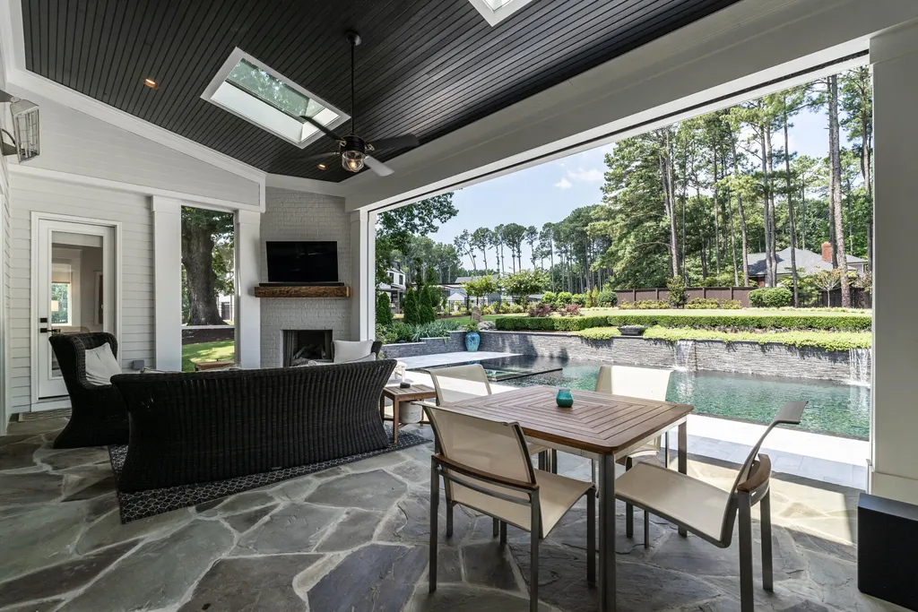 1632 Estate Valley Lane Home in Raleigh, North Carolina. Step into a realm where the pressures of daily life dissolve into the serene blue depths of the pool. Experience daily pampering while engaging in ordinary activities. This impeccable residence seamlessly blends the finest aspects of living, incorporating design and upgrades that effortlessly enhance ease and comfort. 