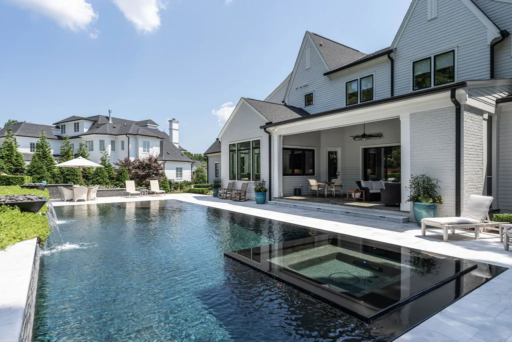1632 Estate Valley Lane Home in Raleigh, North Carolina. Step into a realm where the pressures of daily life dissolve into the serene blue depths of the pool. Experience daily pampering while engaging in ordinary activities. This impeccable residence seamlessly blends the finest aspects of living, incorporating design and upgrades that effortlessly enhance ease and comfort. 