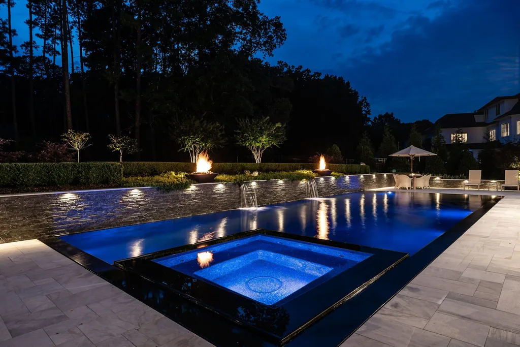 1632 Estate Valley Lane Home in Raleigh, North Carolina. Step into a realm where the pressures of daily life dissolve into the serene blue depths of the pool. Experience daily pampering while engaging in ordinary activities. This impeccable residence seamlessly blends the finest aspects of living, incorporating design and upgrades that effortlessly enhance ease and comfort. 