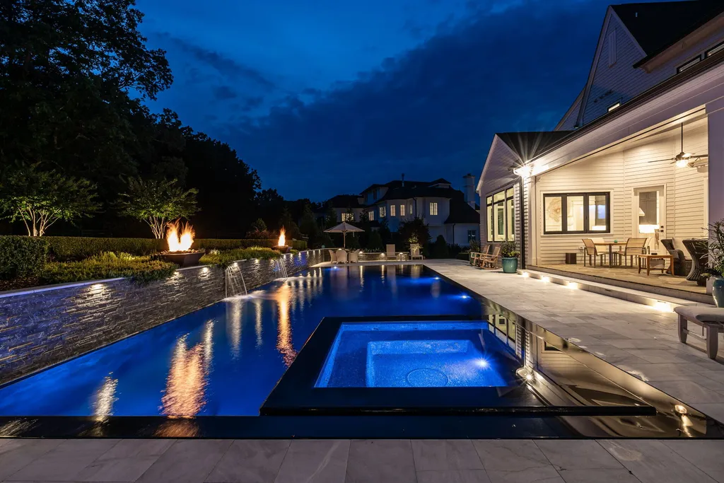 1632 Estate Valley Lane Home in Raleigh, North Carolina. Step into a realm where the pressures of daily life dissolve into the serene blue depths of the pool. Experience daily pampering while engaging in ordinary activities. This impeccable residence seamlessly blends the finest aspects of living, incorporating design and upgrades that effortlessly enhance ease and comfort. 