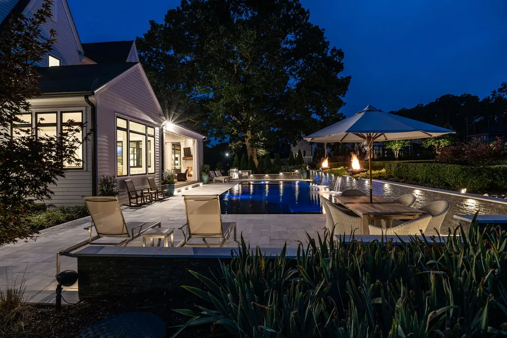 1632 Estate Valley Lane Home in Raleigh, North Carolina. Step into a realm where the pressures of daily life dissolve into the serene blue depths of the pool. Experience daily pampering while engaging in ordinary activities. This impeccable residence seamlessly blends the finest aspects of living, incorporating design and upgrades that effortlessly enhance ease and comfort. 