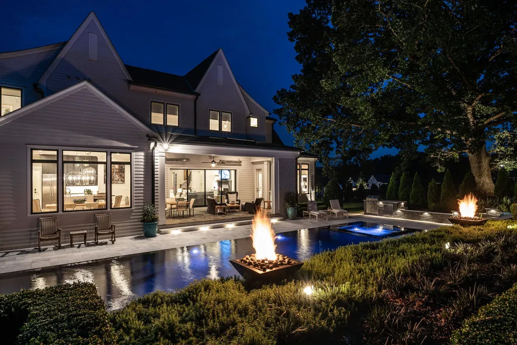 1632 Estate Valley Lane Home in Raleigh, North Carolina. Step into a realm where the pressures of daily life dissolve into the serene blue depths of the pool. Experience daily pampering while engaging in ordinary activities. This impeccable residence seamlessly blends the finest aspects of living, incorporating design and upgrades that effortlessly enhance ease and comfort. 