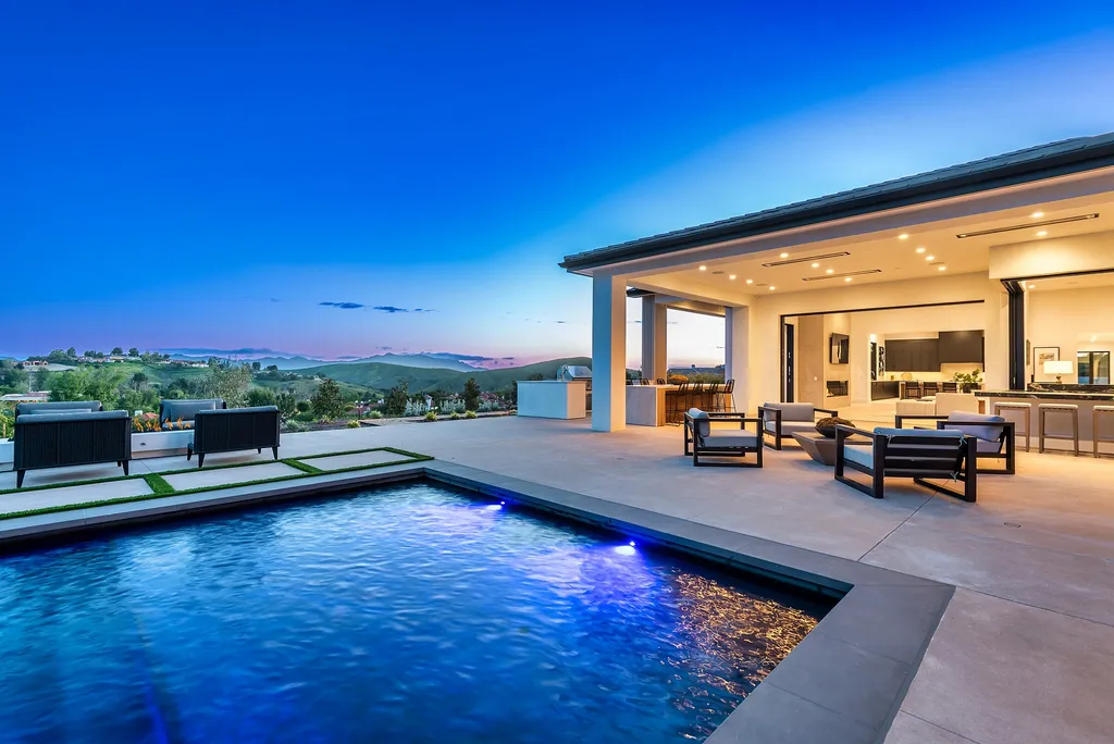 1856 Dawn Meadow Street Home in Thousand Oaks, California. Discover the pinnacle of luxury living in this newly constructed contemporary masterpiece nestled in North Ranch's High Country section. With 11,000 square feet of single-story opulence, this 6-bedroom, 9-bathroom home features a theater, wine wall, game room, and more. 