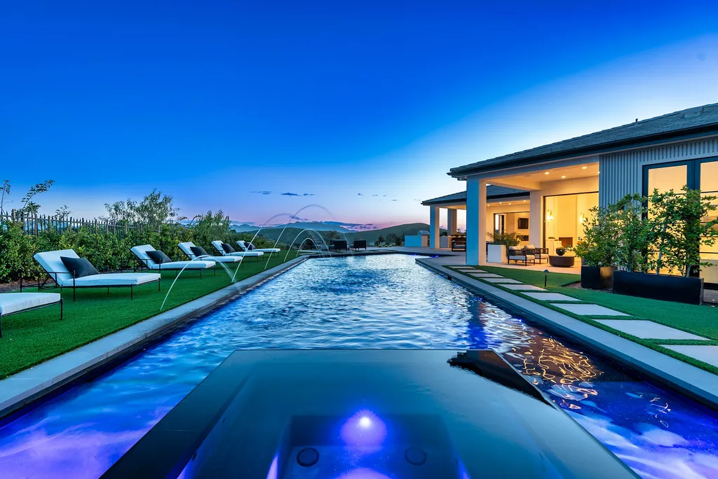 1856 Dawn Meadow Street Home in Thousand Oaks, California. Discover the pinnacle of luxury living in this newly constructed contemporary masterpiece nestled in North Ranch's High Country section. With 11,000 square feet of single-story opulence, this 6-bedroom, 9-bathroom home features a theater, wine wall, game room, and more. 