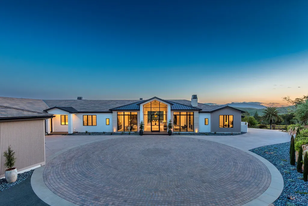1856 Dawn Meadow Street Home in Thousand Oaks, California. Discover the pinnacle of luxury living in this newly constructed contemporary masterpiece nestled in North Ranch's High Country section. With 11,000 square feet of single-story opulence, this 6-bedroom, 9-bathroom home features a theater, wine wall, game room, and more. 