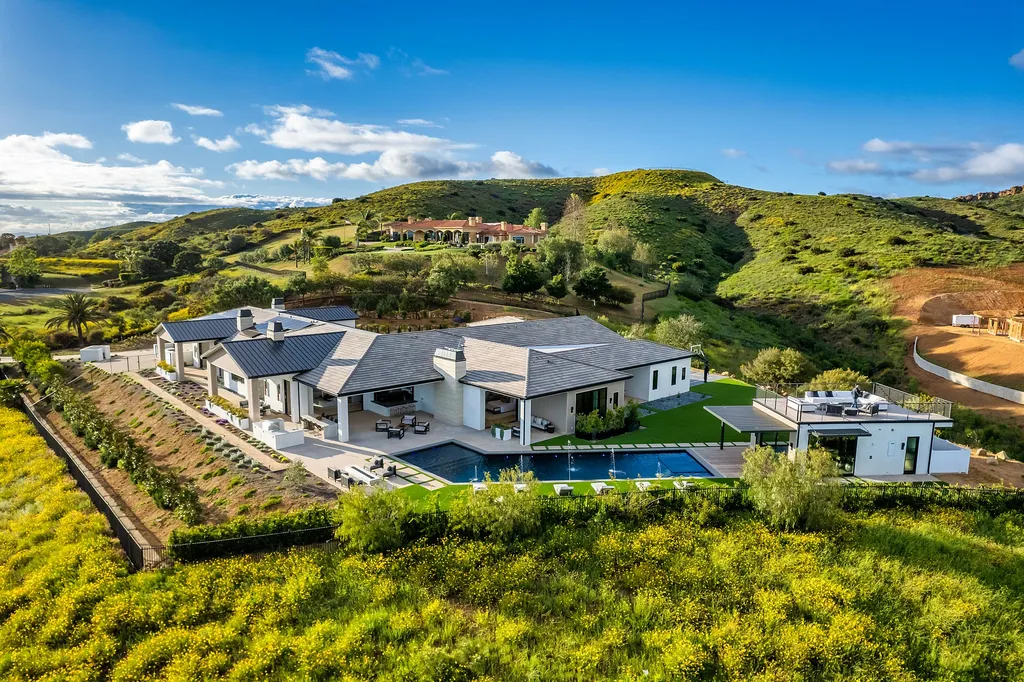 1856 Dawn Meadow Street Home in Thousand Oaks, California. Discover the pinnacle of luxury living in this newly constructed contemporary masterpiece nestled in North Ranch's High Country section. With 11,000 square feet of single-story opulence, this 6-bedroom, 9-bathroom home features a theater, wine wall, game room, and more. 