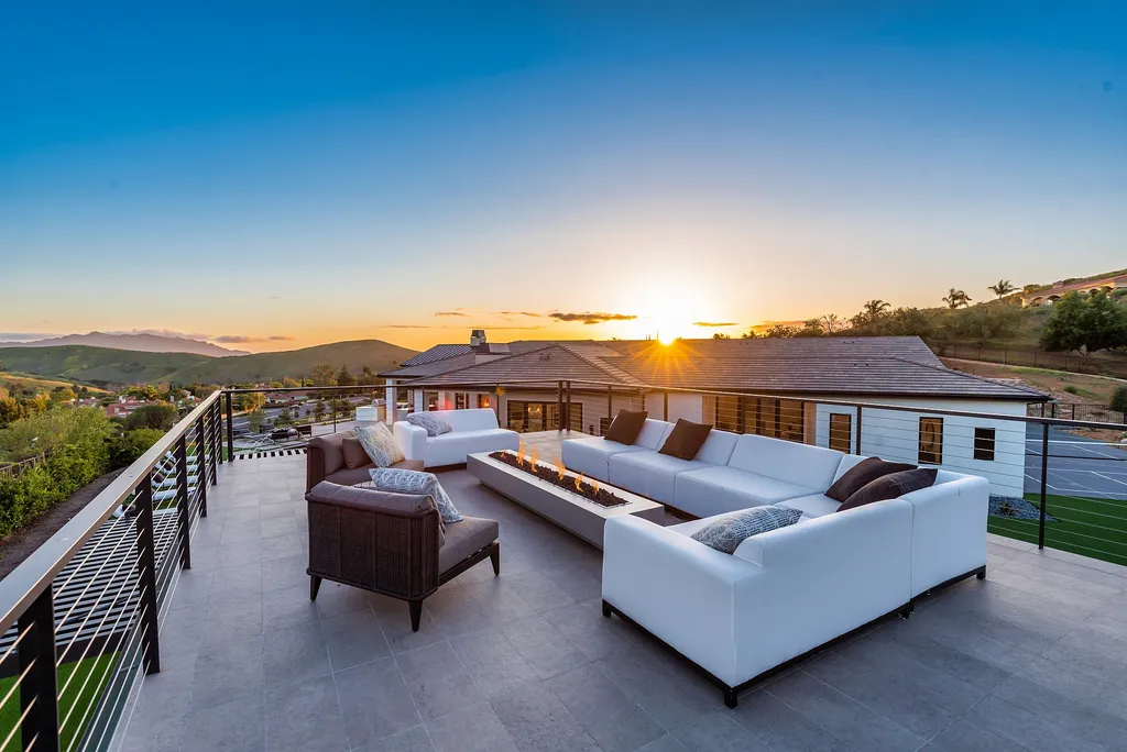 1856 Dawn Meadow Street Home in Thousand Oaks, California. Discover the pinnacle of luxury living in this newly constructed contemporary masterpiece nestled in North Ranch's High Country section. With 11,000 square feet of single-story opulence, this 6-bedroom, 9-bathroom home features a theater, wine wall, game room, and more. 