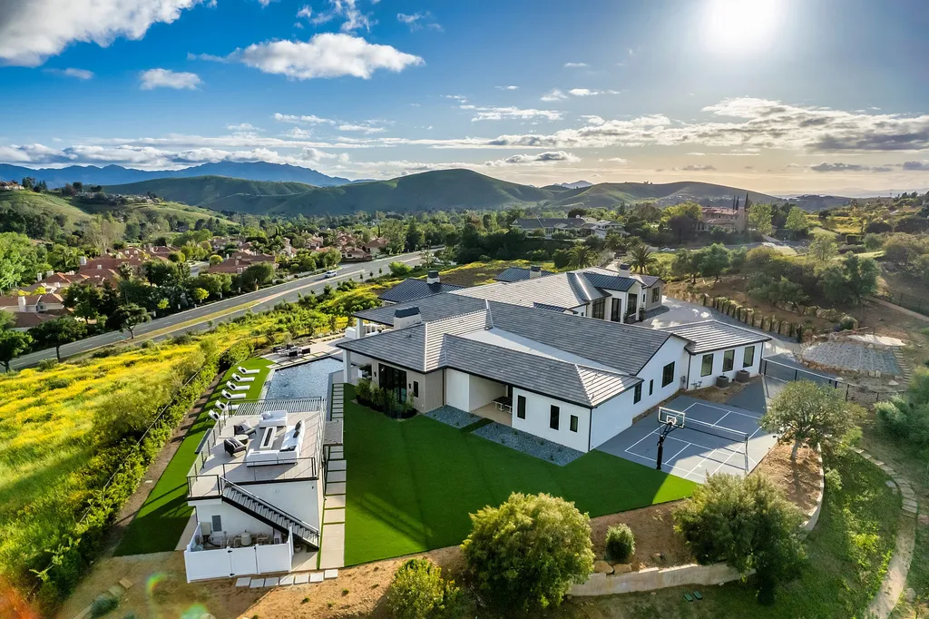1856 Dawn Meadow Street Home in Thousand Oaks, California. Discover the pinnacle of luxury living in this newly constructed contemporary masterpiece nestled in North Ranch's High Country section. With 11,000 square feet of single-story opulence, this 6-bedroom, 9-bathroom home features a theater, wine wall, game room, and more. 
