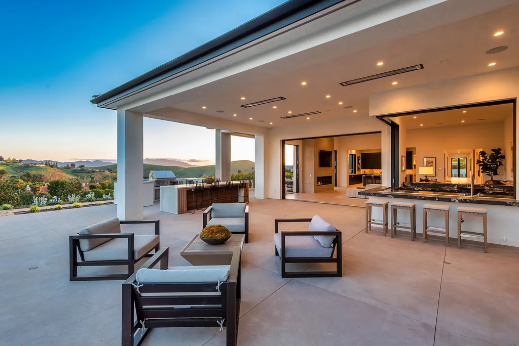 1856 Dawn Meadow Street Home in Thousand Oaks, California. Discover the pinnacle of luxury living in this newly constructed contemporary masterpiece nestled in North Ranch's High Country section. With 11,000 square feet of single-story opulence, this 6-bedroom, 9-bathroom home features a theater, wine wall, game room, and more. 