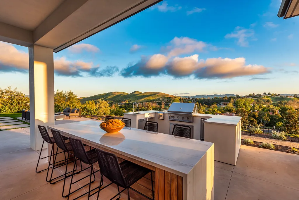 1856 Dawn Meadow Street Home in Thousand Oaks, California. Discover the pinnacle of luxury living in this newly constructed contemporary masterpiece nestled in North Ranch's High Country section. With 11,000 square feet of single-story opulence, this 6-bedroom, 9-bathroom home features a theater, wine wall, game room, and more. 
