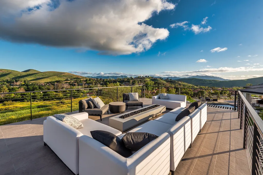 1856 Dawn Meadow Street Home in Thousand Oaks, California. Discover the pinnacle of luxury living in this newly constructed contemporary masterpiece nestled in North Ranch's High Country section. With 11,000 square feet of single-story opulence, this 6-bedroom, 9-bathroom home features a theater, wine wall, game room, and more. 