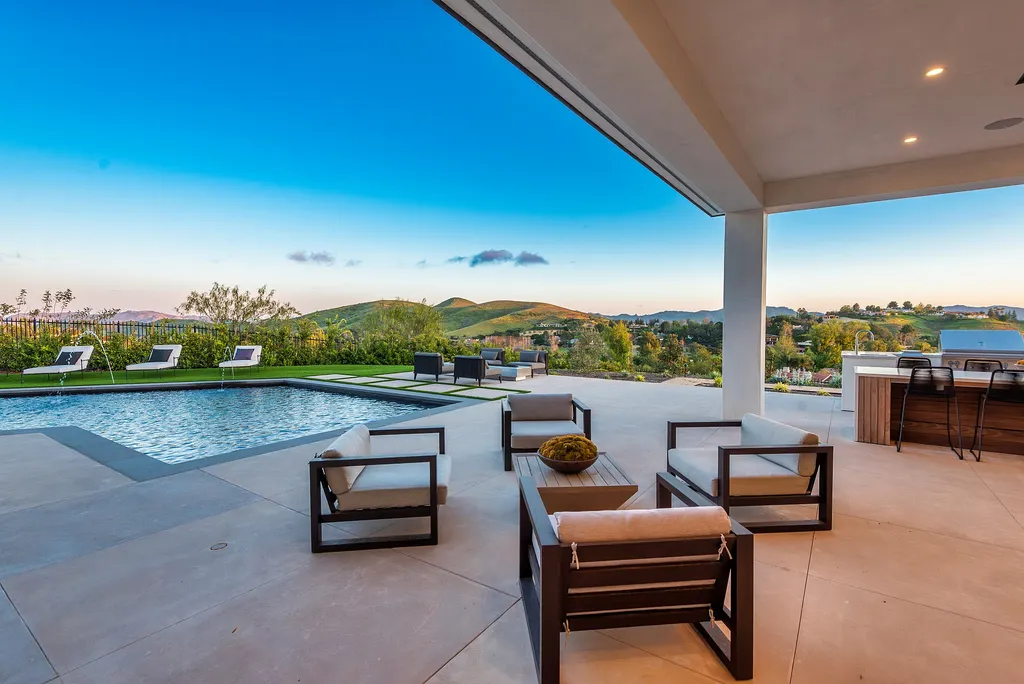 1856 Dawn Meadow Street Home in Thousand Oaks, California. Discover the pinnacle of luxury living in this newly constructed contemporary masterpiece nestled in North Ranch's High Country section. With 11,000 square feet of single-story opulence, this 6-bedroom, 9-bathroom home features a theater, wine wall, game room, and more. 