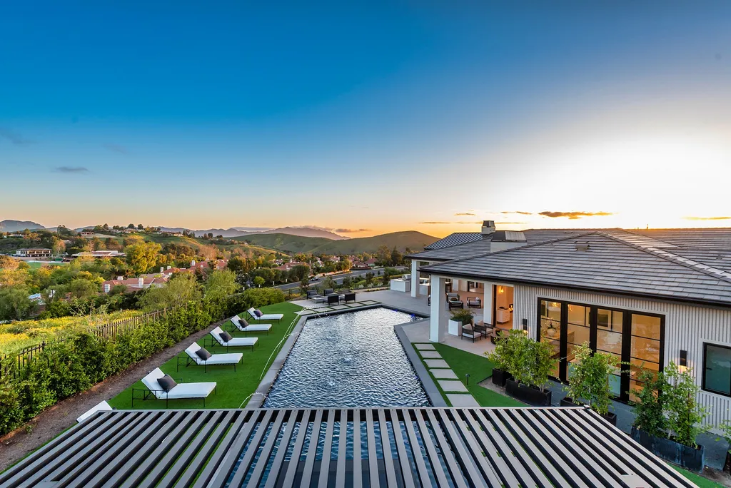 1856 Dawn Meadow Street Home in Thousand Oaks, California. Discover the pinnacle of luxury living in this newly constructed contemporary masterpiece nestled in North Ranch's High Country section. With 11,000 square feet of single-story opulence, this 6-bedroom, 9-bathroom home features a theater, wine wall, game room, and more. 