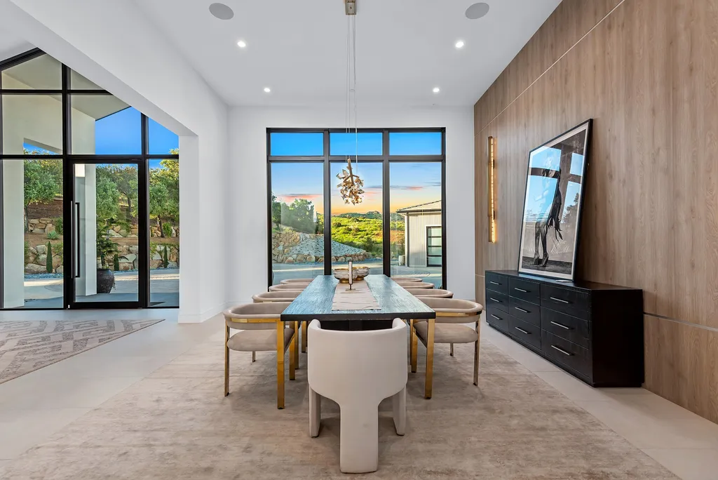 1856 Dawn Meadow Street Home in Thousand Oaks, California. Discover the pinnacle of luxury living in this newly constructed contemporary masterpiece nestled in North Ranch's High Country section. With 11,000 square feet of single-story opulence, this 6-bedroom, 9-bathroom home features a theater, wine wall, game room, and more. 