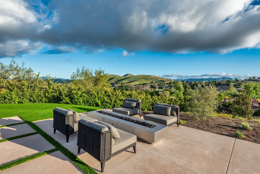 1856 Dawn Meadow Street Home in Thousand Oaks, California. Discover the pinnacle of luxury living in this newly constructed contemporary masterpiece nestled in North Ranch's High Country section. With 11,000 square feet of single-story opulence, this 6-bedroom, 9-bathroom home features a theater, wine wall, game room, and more. 