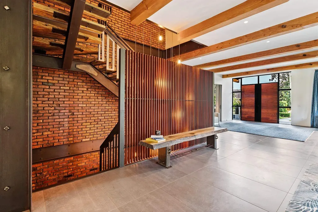 2315 Beechridge Road Home in Raleigh, North Carolina. Step into a modernist masterpiece where open living, natural light, and dramatic vaulted ceilings converge. This architectural gem is a true work of art, featuring a harmonious blend of unique natural woods, contemporary materials, and expansive windows. Discover a sanctuary of tranquility and design, nestled on an acre plus lot in Raleigh's sought-after legacy neighborhood.