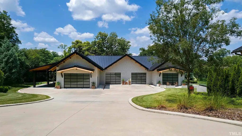 2315 Beechridge Road Home in Raleigh, North Carolina. Step into a modernist masterpiece where open living, natural light, and dramatic vaulted ceilings converge. This architectural gem is a true work of art, featuring a harmonious blend of unique natural woods, contemporary materials, and expansive windows. Discover a sanctuary of tranquility and design, nestled on an acre plus lot in Raleigh's sought-after legacy neighborhood.