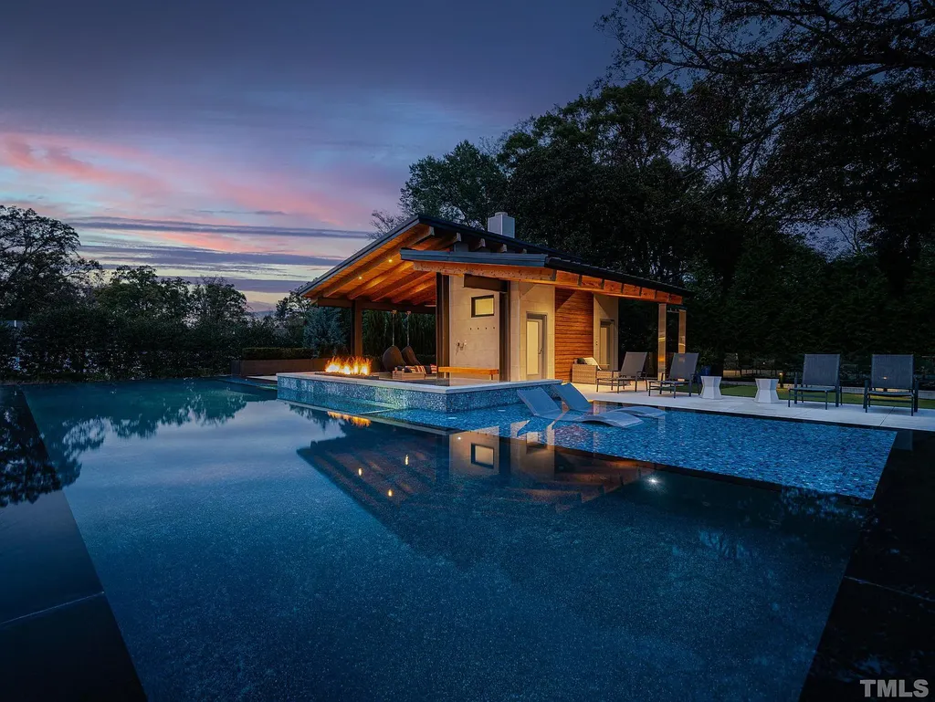 2315 Beechridge Road Home in Raleigh, North Carolina. Step into a modernist masterpiece where open living, natural light, and dramatic vaulted ceilings converge. This architectural gem is a true work of art, featuring a harmonious blend of unique natural woods, contemporary materials, and expansive windows. Discover a sanctuary of tranquility and design, nestled on an acre plus lot in Raleigh's sought-after legacy neighborhood.