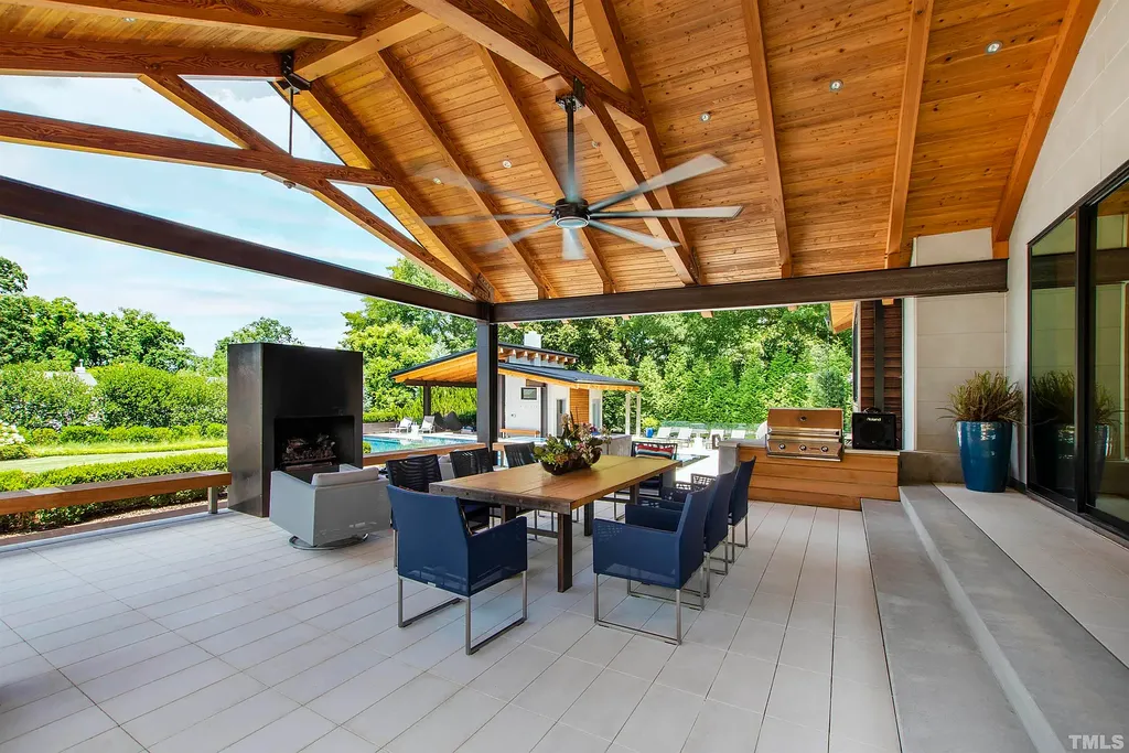 2315 Beechridge Road Home in Raleigh, North Carolina. Step into a modernist masterpiece where open living, natural light, and dramatic vaulted ceilings converge. This architectural gem is a true work of art, featuring a harmonious blend of unique natural woods, contemporary materials, and expansive windows. Discover a sanctuary of tranquility and design, nestled on an acre plus lot in Raleigh's sought-after legacy neighborhood.