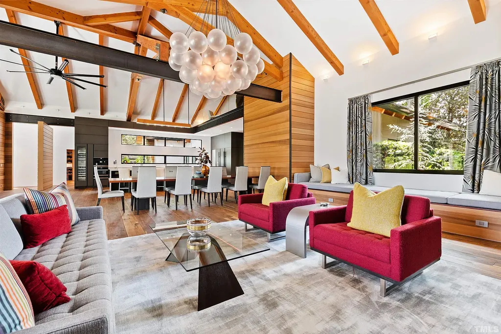 2315 Beechridge Road Home in Raleigh, North Carolina. Step into a modernist masterpiece where open living, natural light, and dramatic vaulted ceilings converge. This architectural gem is a true work of art, featuring a harmonious blend of unique natural woods, contemporary materials, and expansive windows. Discover a sanctuary of tranquility and design, nestled on an acre plus lot in Raleigh's sought-after legacy neighborhood.