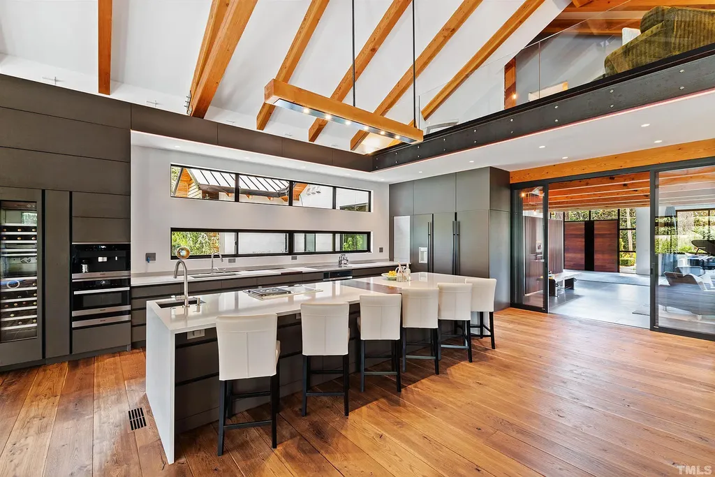 2315 Beechridge Road Home in Raleigh, North Carolina. Step into a modernist masterpiece where open living, natural light, and dramatic vaulted ceilings converge. This architectural gem is a true work of art, featuring a harmonious blend of unique natural woods, contemporary materials, and expansive windows. Discover a sanctuary of tranquility and design, nestled on an acre plus lot in Raleigh's sought-after legacy neighborhood.