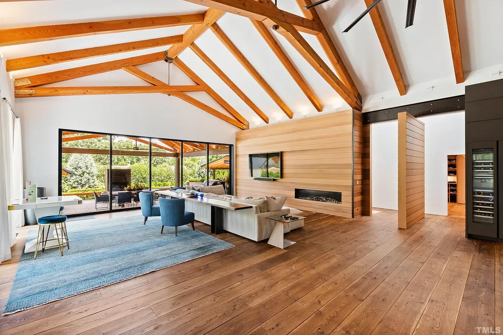 2315 Beechridge Road Home in Raleigh, North Carolina. Step into a modernist masterpiece where open living, natural light, and dramatic vaulted ceilings converge. This architectural gem is a true work of art, featuring a harmonious blend of unique natural woods, contemporary materials, and expansive windows. Discover a sanctuary of tranquility and design, nestled on an acre plus lot in Raleigh's sought-after legacy neighborhood.