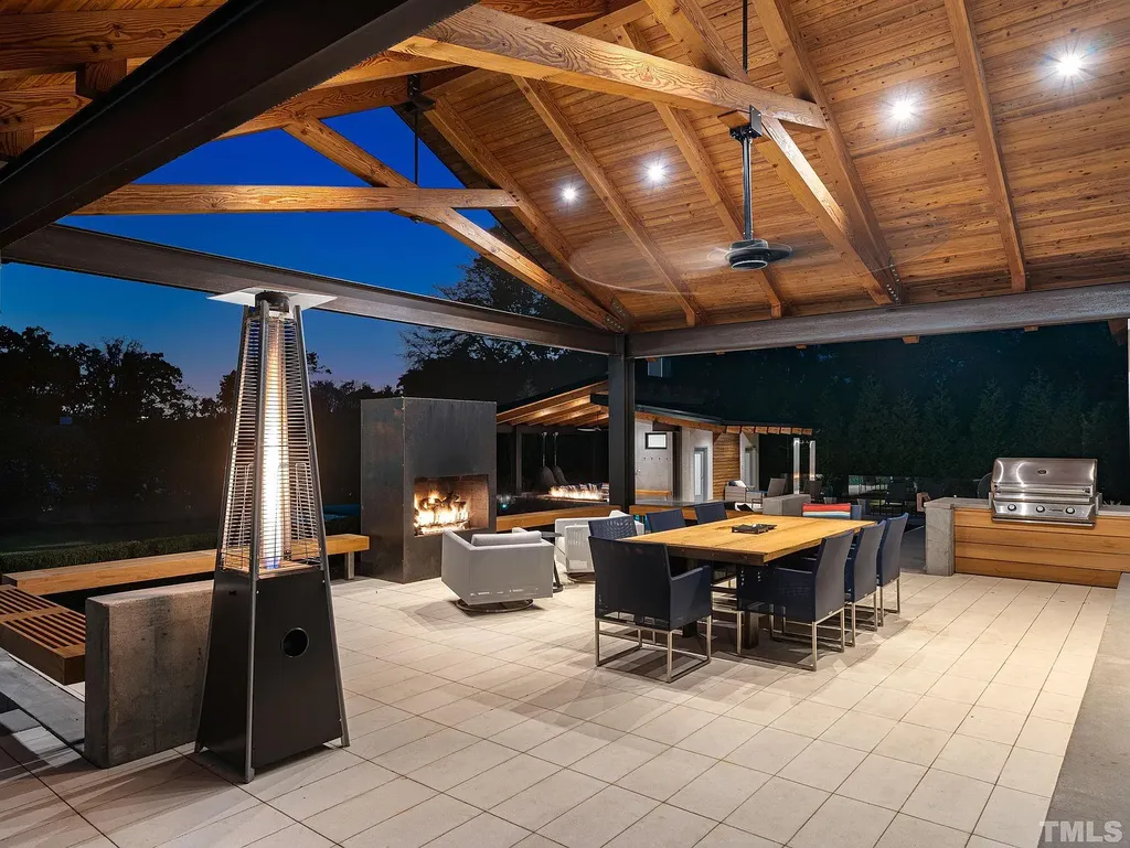 2315 Beechridge Road Home in Raleigh, North Carolina. Step into a modernist masterpiece where open living, natural light, and dramatic vaulted ceilings converge. This architectural gem is a true work of art, featuring a harmonious blend of unique natural woods, contemporary materials, and expansive windows. Discover a sanctuary of tranquility and design, nestled on an acre plus lot in Raleigh's sought-after legacy neighborhood.