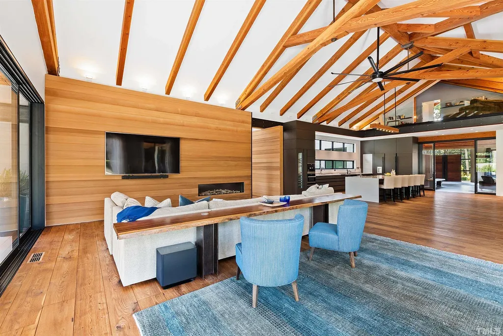 2315 Beechridge Road Home in Raleigh, North Carolina. Step into a modernist masterpiece where open living, natural light, and dramatic vaulted ceilings converge. This architectural gem is a true work of art, featuring a harmonious blend of unique natural woods, contemporary materials, and expansive windows. Discover a sanctuary of tranquility and design, nestled on an acre plus lot in Raleigh's sought-after legacy neighborhood.