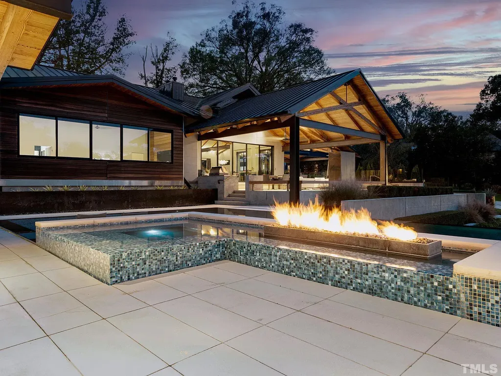 2315 Beechridge Road Home in Raleigh, North Carolina. Step into a modernist masterpiece where open living, natural light, and dramatic vaulted ceilings converge. This architectural gem is a true work of art, featuring a harmonious blend of unique natural woods, contemporary materials, and expansive windows. Discover a sanctuary of tranquility and design, nestled on an acre plus lot in Raleigh's sought-after legacy neighborhood.