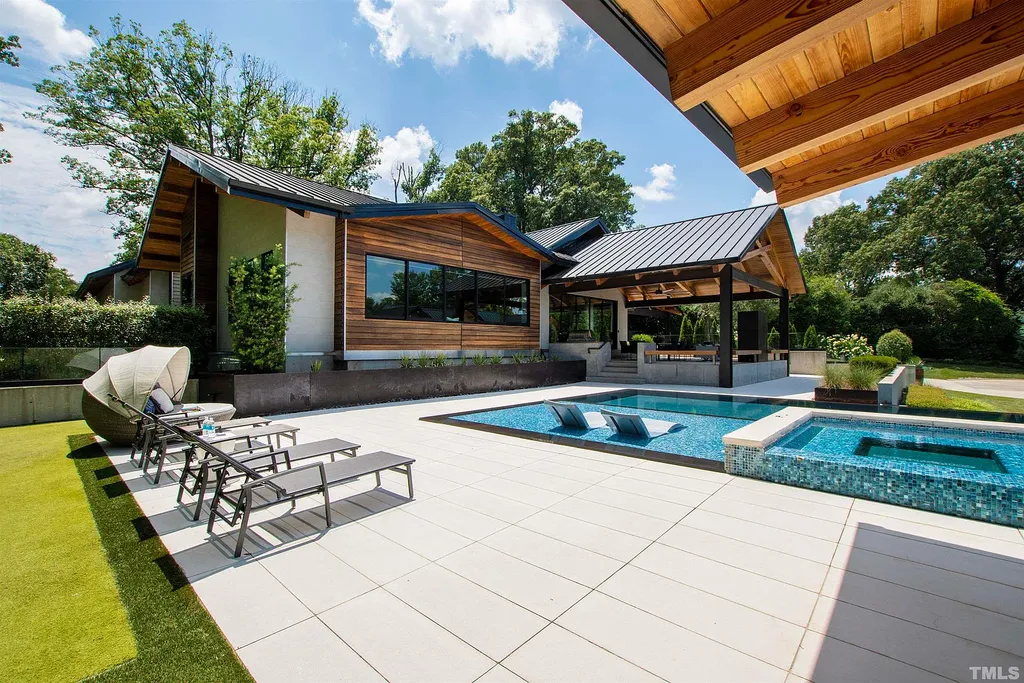 2315 Beechridge Road Home in Raleigh, North Carolina. Step into a modernist masterpiece where open living, natural light, and dramatic vaulted ceilings converge. This architectural gem is a true work of art, featuring a harmonious blend of unique natural woods, contemporary materials, and expansive windows. Discover a sanctuary of tranquility and design, nestled on an acre plus lot in Raleigh's sought-after legacy neighborhood.