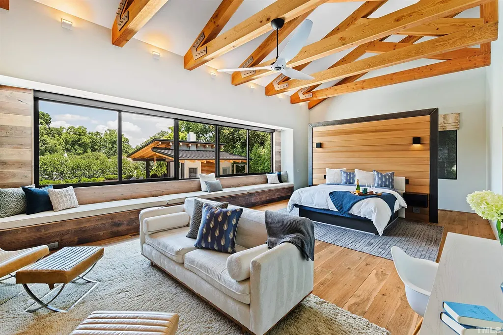 2315 Beechridge Road Home in Raleigh, North Carolina. Step into a modernist masterpiece where open living, natural light, and dramatic vaulted ceilings converge. This architectural gem is a true work of art, featuring a harmonious blend of unique natural woods, contemporary materials, and expansive windows. Discover a sanctuary of tranquility and design, nestled on an acre plus lot in Raleigh's sought-after legacy neighborhood.