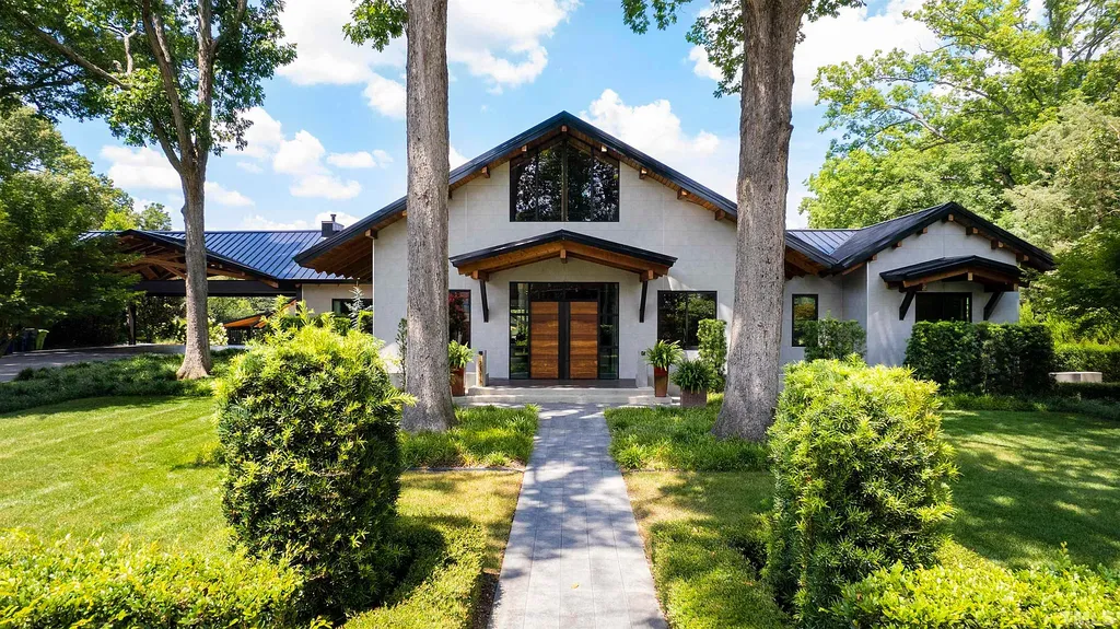 2315 Beechridge Road Home in Raleigh, North Carolina. Step into a modernist masterpiece where open living, natural light, and dramatic vaulted ceilings converge. This architectural gem is a true work of art, featuring a harmonious blend of unique natural woods, contemporary materials, and expansive windows. Discover a sanctuary of tranquility and design, nestled on an acre plus lot in Raleigh's sought-after legacy neighborhood.