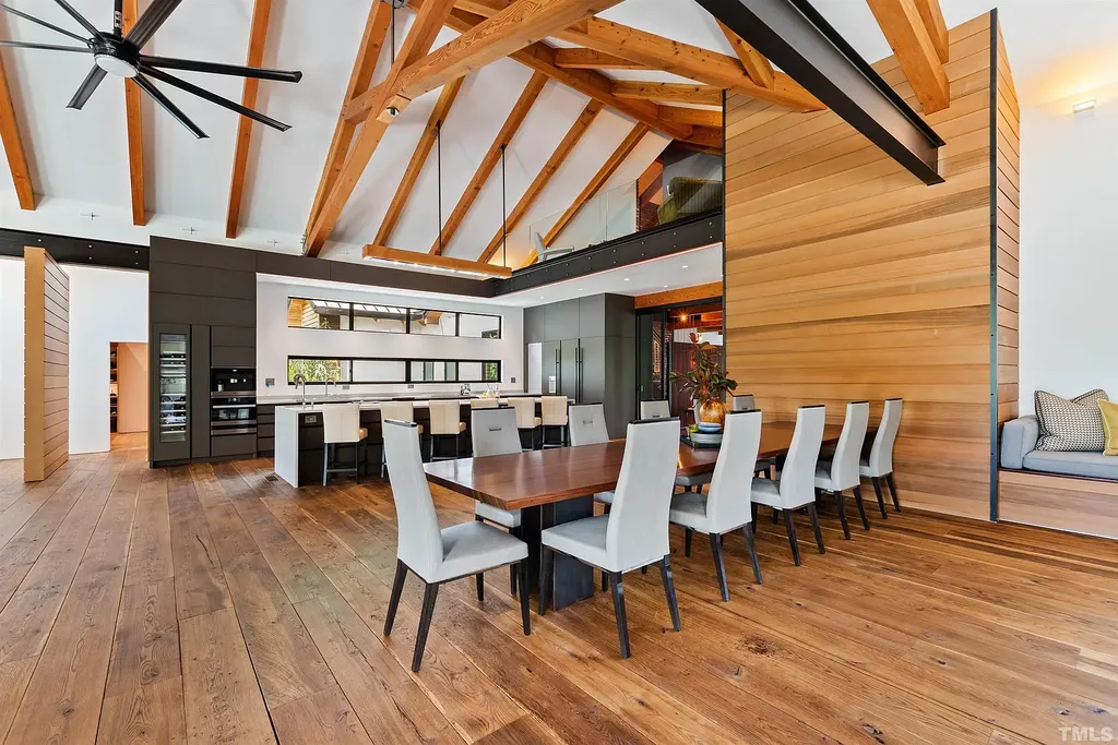 2315 Beechridge Road Home in Raleigh, North Carolina. Step into a modernist masterpiece where open living, natural light, and dramatic vaulted ceilings converge. This architectural gem is a true work of art, featuring a harmonious blend of unique natural woods, contemporary materials, and expansive windows. Discover a sanctuary of tranquility and design, nestled on an acre plus lot in Raleigh's sought-after legacy neighborhood.