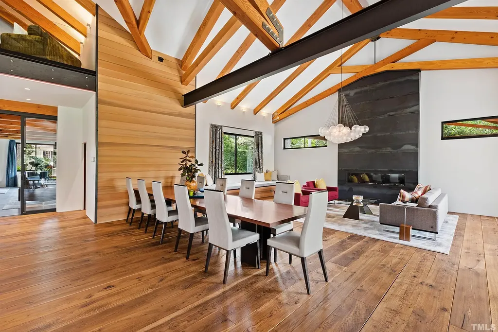 2315 Beechridge Road Home in Raleigh, North Carolina. Step into a modernist masterpiece where open living, natural light, and dramatic vaulted ceilings converge. This architectural gem is a true work of art, featuring a harmonious blend of unique natural woods, contemporary materials, and expansive windows. Discover a sanctuary of tranquility and design, nestled on an acre plus lot in Raleigh's sought-after legacy neighborhood.