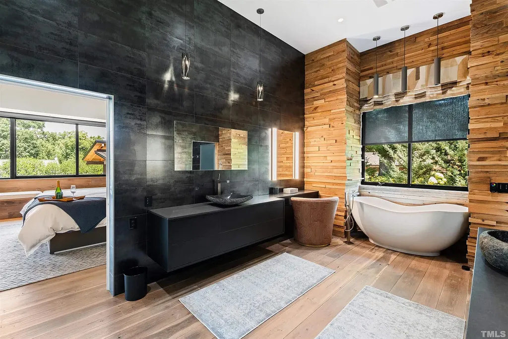 2315 Beechridge Road Home in Raleigh, North Carolina. Step into a modernist masterpiece where open living, natural light, and dramatic vaulted ceilings converge. This architectural gem is a true work of art, featuring a harmonious blend of unique natural woods, contemporary materials, and expansive windows. Discover a sanctuary of tranquility and design, nestled on an acre plus lot in Raleigh's sought-after legacy neighborhood.