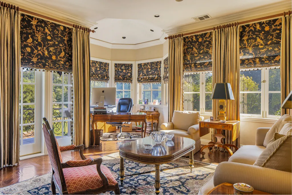 240 West Stafford Road Home in Thousand Oaks, California. This luxurious estate is located in the guard-gated community of Sherwood Country Club, just minutes from acclaimed schools, shopping, and fine dining. The home is adjacent to Hole 11 Island Green on the Jack Nicklaus-designed championship golf course and offers stunning views of the course and the surrounding area.