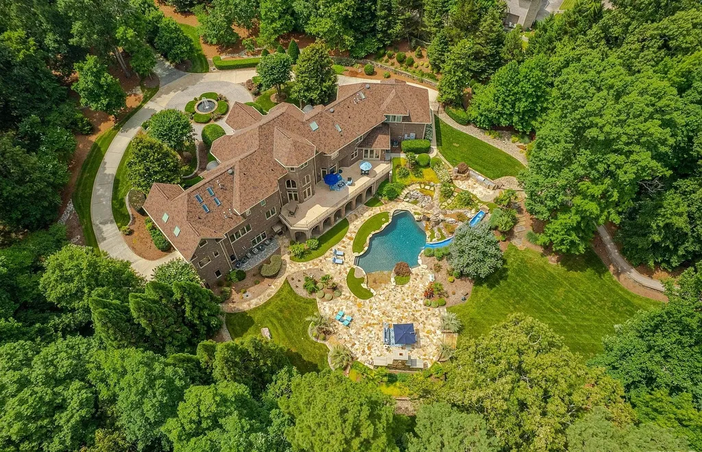 2421 Acanthus Drive Home in Wake Forest, North Carolina. Step into the world of luxury with this exceptional gated estate located in the Back Nine, featured in the Parade of Homes. Spanning 14,438 sqft, this masterfully crafted home boasts 6 bedrooms, 9 bathrooms, and lavish finishes throughout. Enjoy the grand foyer, two kitchens, theater room, wine cellar, and exercise room.