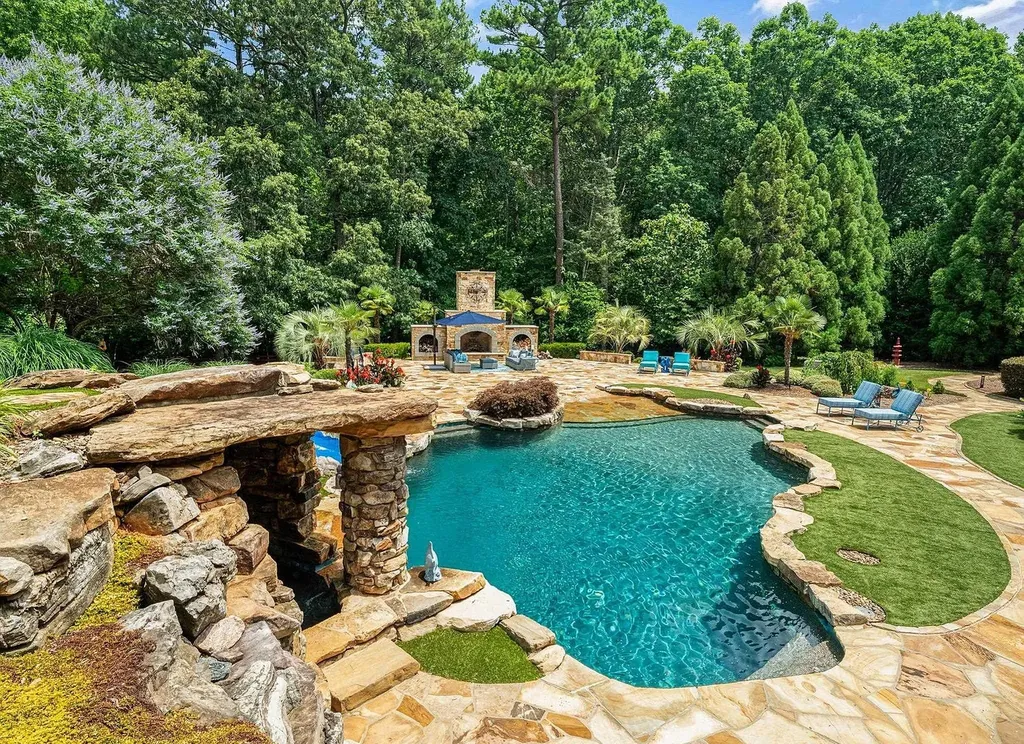 2421 Acanthus Drive Home in Wake Forest, North Carolina. Step into the world of luxury with this exceptional gated estate located in the Back Nine, featured in the Parade of Homes. Spanning 14,438 sqft, this masterfully crafted home boasts 6 bedrooms, 9 bathrooms, and lavish finishes throughout. Enjoy the grand foyer, two kitchens, theater room, wine cellar, and exercise room.