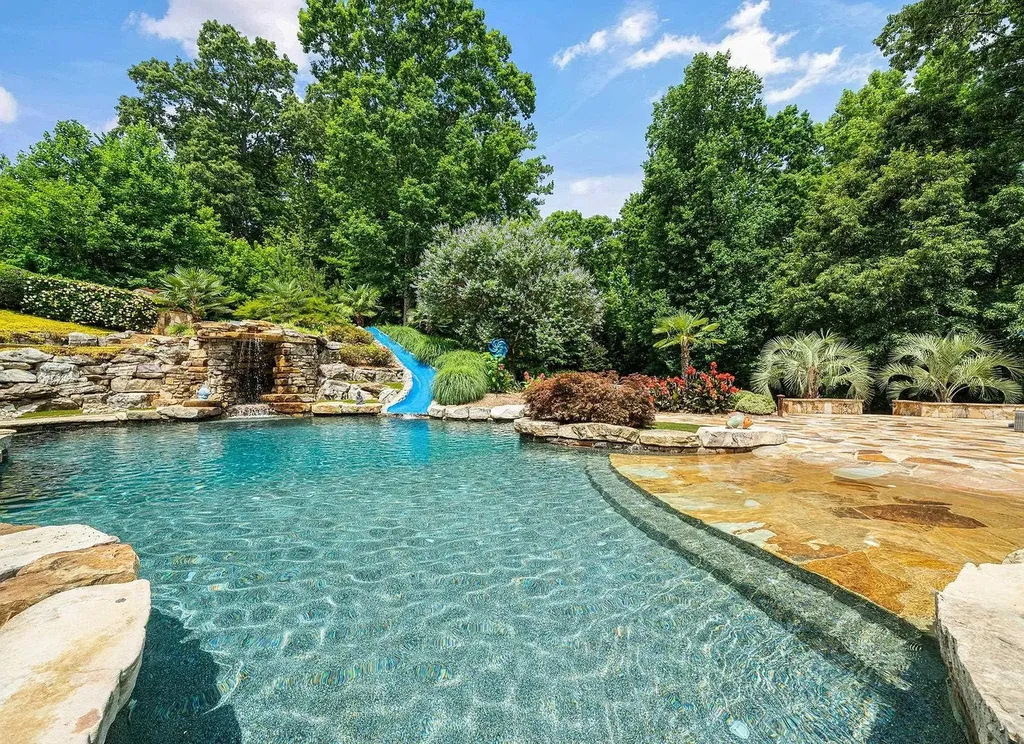 2421 Acanthus Drive Home in Wake Forest, North Carolina. Step into the world of luxury with this exceptional gated estate located in the Back Nine, featured in the Parade of Homes. Spanning 14,438 sqft, this masterfully crafted home boasts 6 bedrooms, 9 bathrooms, and lavish finishes throughout. Enjoy the grand foyer, two kitchens, theater room, wine cellar, and exercise room.