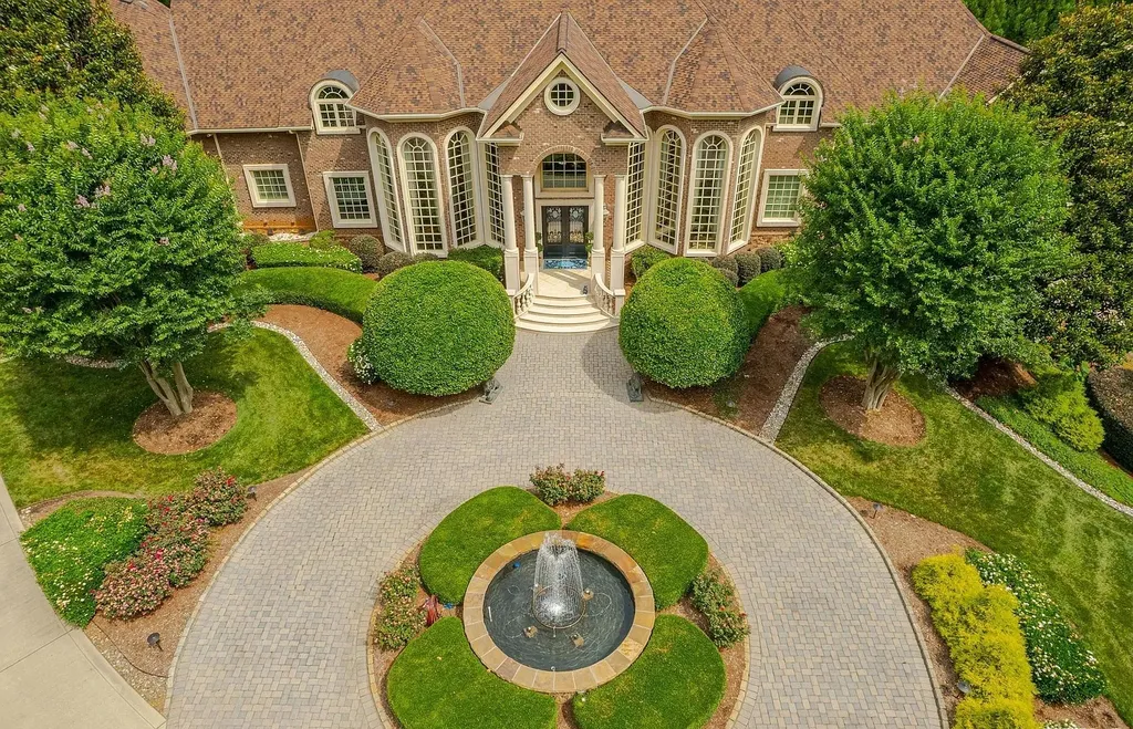 2421 Acanthus Drive Home in Wake Forest, North Carolina. Step into the world of luxury with this exceptional gated estate located in the Back Nine, featured in the Parade of Homes. Spanning 14,438 sqft, this masterfully crafted home boasts 6 bedrooms, 9 bathrooms, and lavish finishes throughout. Enjoy the grand foyer, two kitchens, theater room, wine cellar, and exercise room.