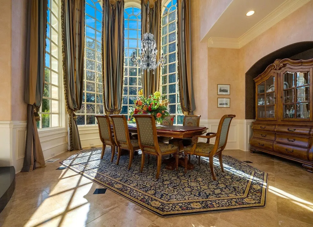 2421 Acanthus Drive Home in Wake Forest, North Carolina. Step into the world of luxury with this exceptional gated estate located in the Back Nine, featured in the Parade of Homes. Spanning 14,438 sqft, this masterfully crafted home boasts 6 bedrooms, 9 bathrooms, and lavish finishes throughout. Enjoy the grand foyer, two kitchens, theater room, wine cellar, and exercise room.
