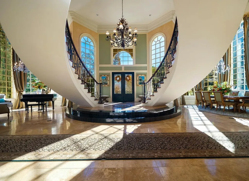 2421 Acanthus Drive Home in Wake Forest, North Carolina. Step into the world of luxury with this exceptional gated estate located in the Back Nine, featured in the Parade of Homes. Spanning 14,438 sqft, this masterfully crafted home boasts 6 bedrooms, 9 bathrooms, and lavish finishes throughout. Enjoy the grand foyer, two kitchens, theater room, wine cellar, and exercise room.