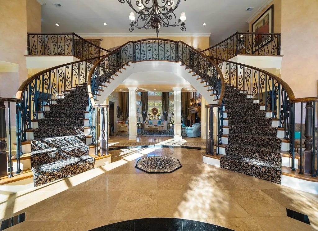 2421 Acanthus Drive Home in Wake Forest, North Carolina. Step into the world of luxury with this exceptional gated estate located in the Back Nine, featured in the Parade of Homes. Spanning 14,438 sqft, this masterfully crafted home boasts 6 bedrooms, 9 bathrooms, and lavish finishes throughout. Enjoy the grand foyer, two kitchens, theater room, wine cellar, and exercise room.